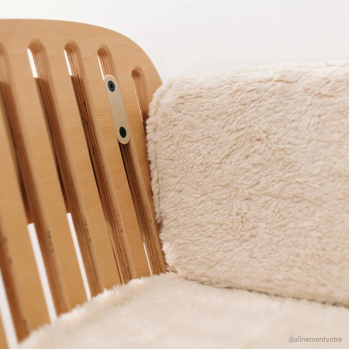 close up of milk fur cover for kodo charlie crane co sleeping crib 