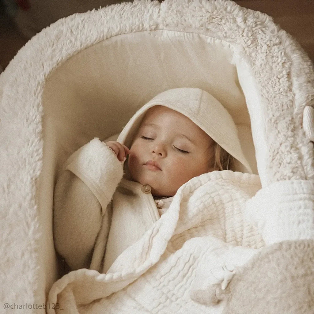 Cozy bedside setup presents the Charlie Crane KUKO Bassinet farrow to sleep with baby safely