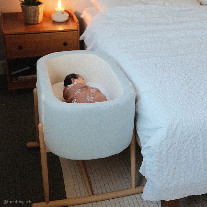 Eco minded nursery highlights the KUKO Bassinet by Charlie Crane in milk fur with eco friendly design