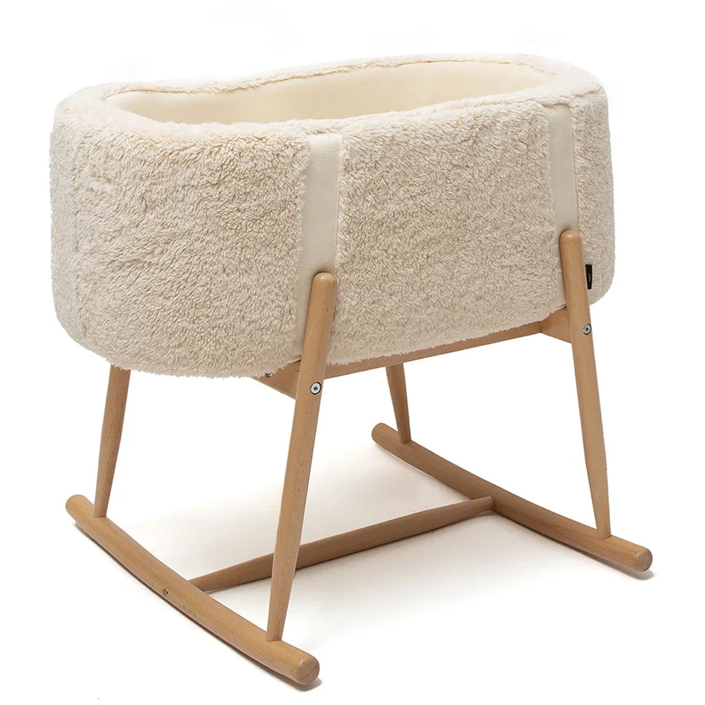 Clean lined space highlights the Charlie Crane Bassinet KUKO in camel with a natural finish