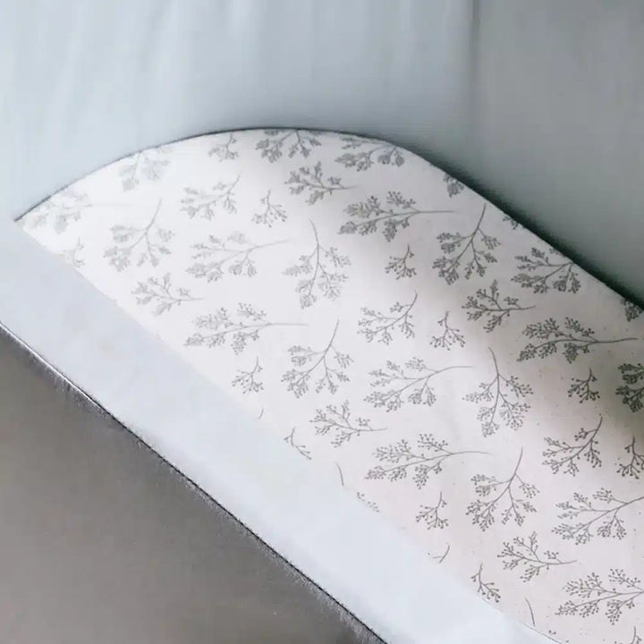 Soft touch fabric close up shows the Fitted Sheet Charlie Crane KUMI and KUKO in pia for infant safe comfort