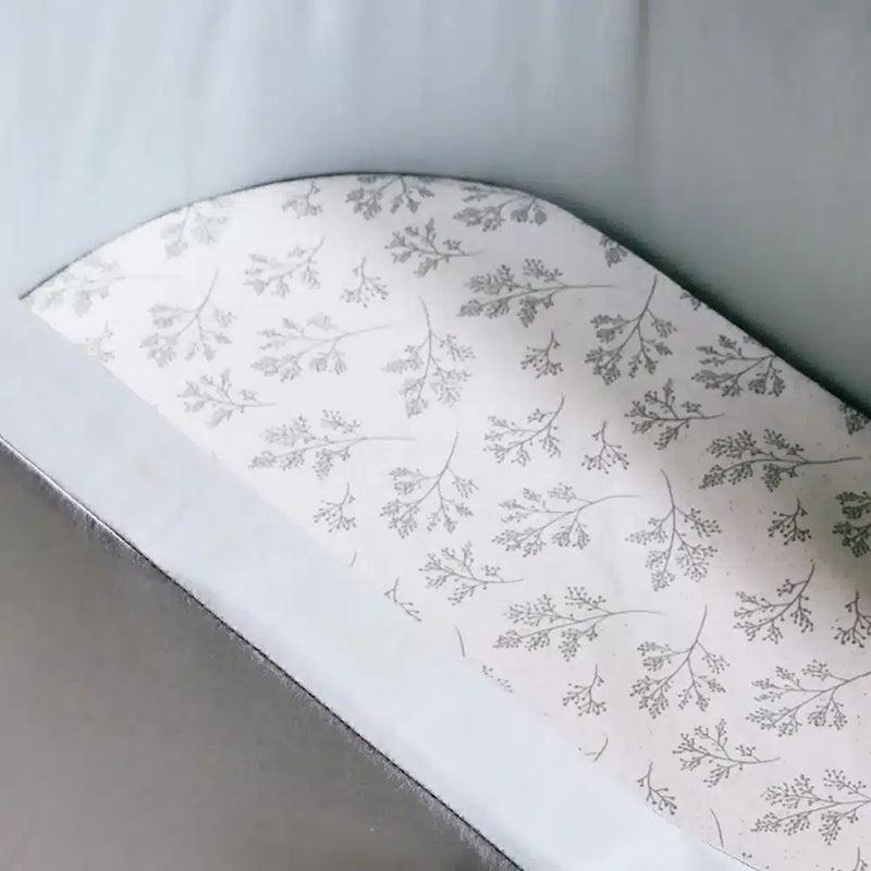 Soft touch fabric close up shows the Fitted Sheet Charlie Crane KUMI and KUKO in pia for infant safe comfort