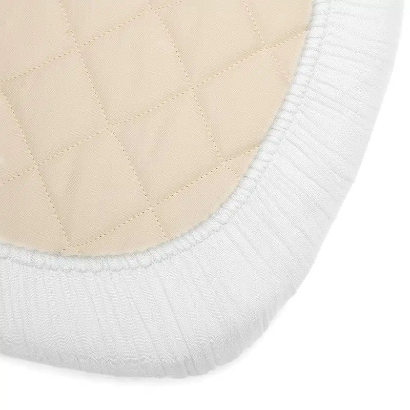 Cozy infant sleep surface displays the Charlie Crane KUKO KUMI Fitted Sheet pearl blossom that is baby safe