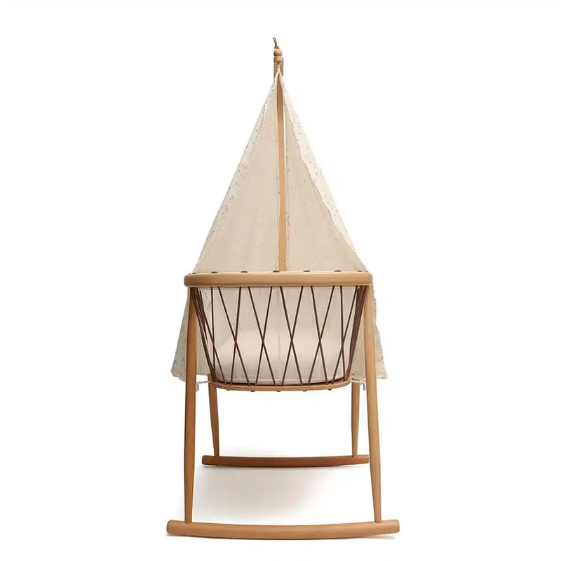 Light filtering detail captures the Canopy KUMI by Charlie Crane in white for newborn safe sleep