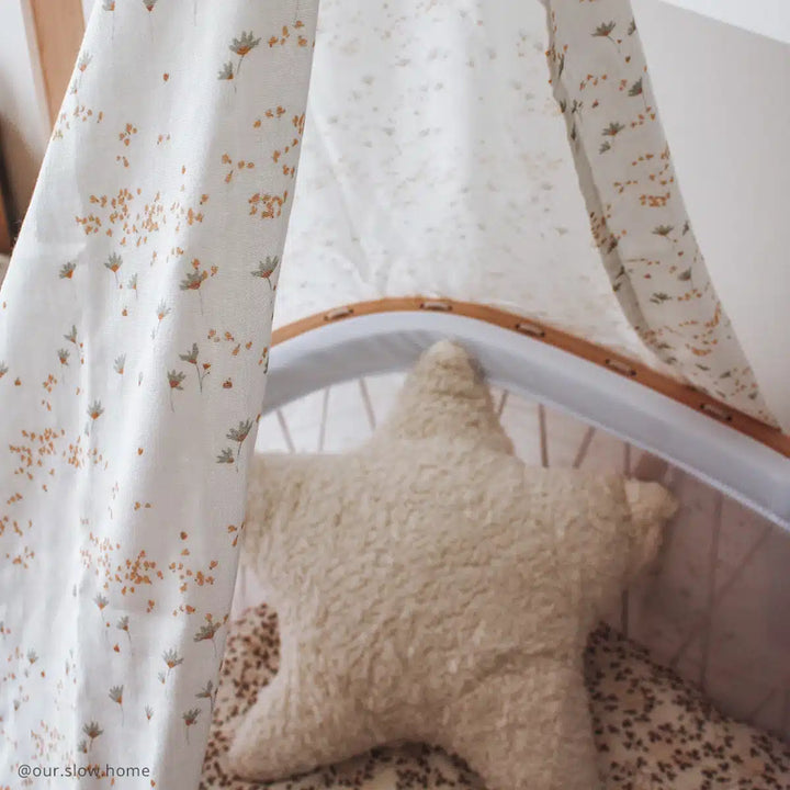 Overhead crib view features the Charlie Crane Canopy KUMI pia for shade sleeping infant