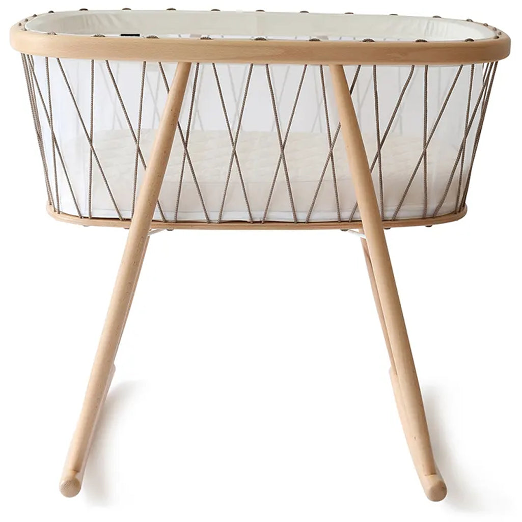 Detailed wood finish presents the Charlie Crane KUMI Cradle bois de rose crafted from natural materials