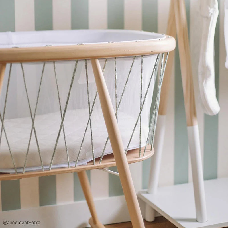 Organic materials detail shows the Charlie Crane KUMI Cradle bois de rose with organic design