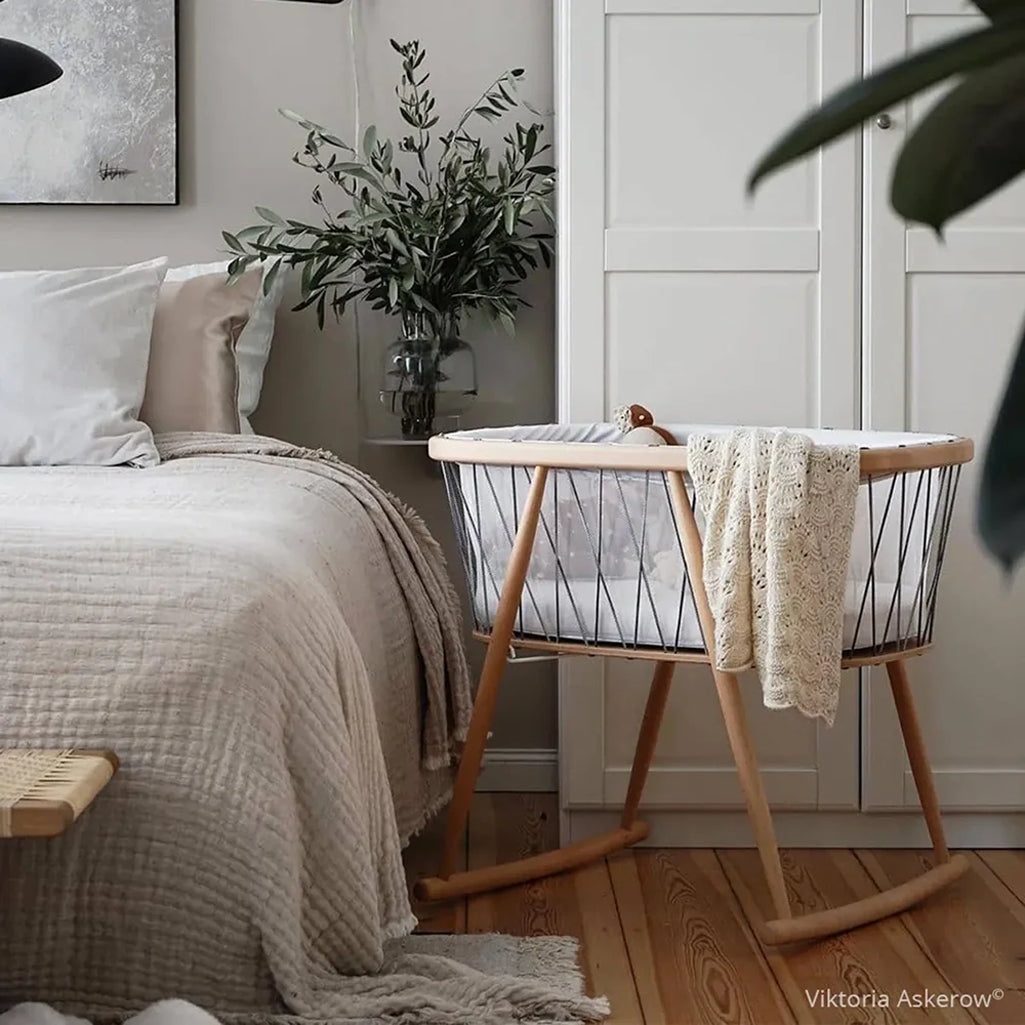 Gentle rocking look features the KUMI Charlie Crane Cradle in desert designed for newborn safe sleep