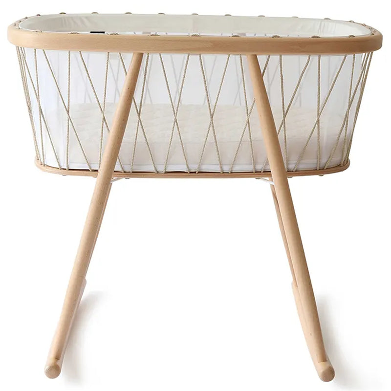 Close up craftsmanship shows the Charlie Crane KUMI Cradle bois de rose with coconut mattress