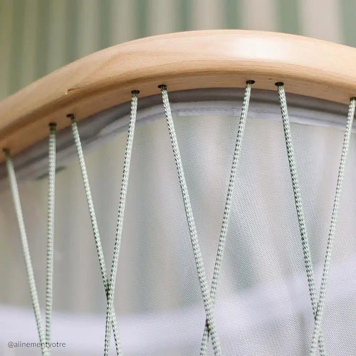 Balanced composition shows the KUMI Charlie Crane Cradle in desert with French inspired form