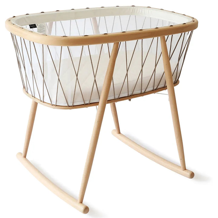 Natural light scene features the Charlie Crane KUMI Cradle bois de rose as eco friendly nursery decor