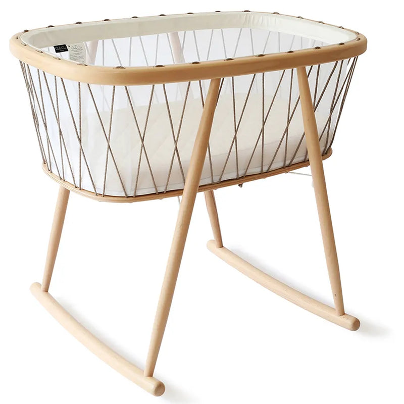 Natural light scene features the Charlie Crane KUMI Cradle bois de rose as eco friendly nursery decor