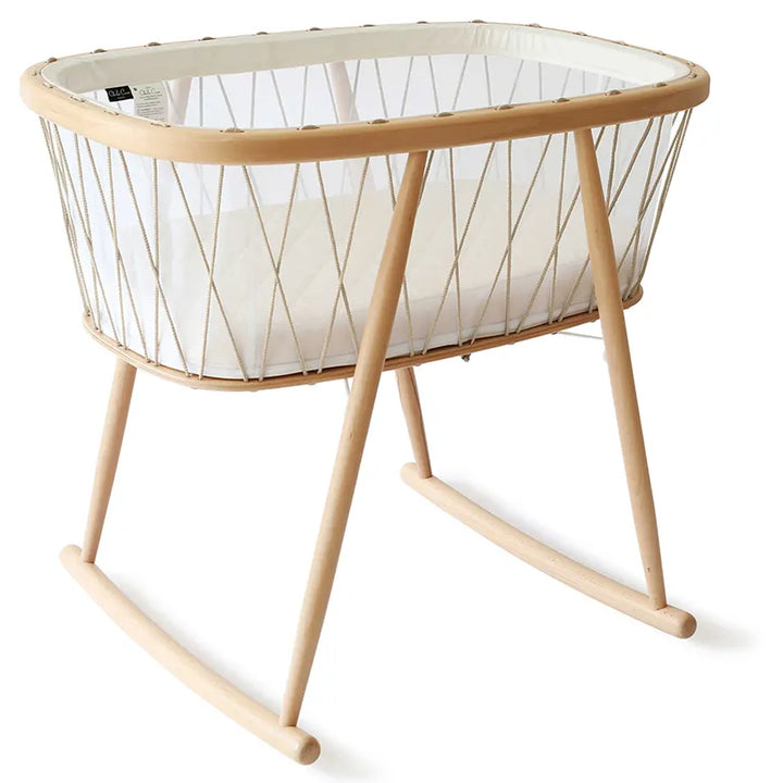 Calm baby space styling highlights the KUMI Charlie Crane Cradle in desert for newborn safe sleep