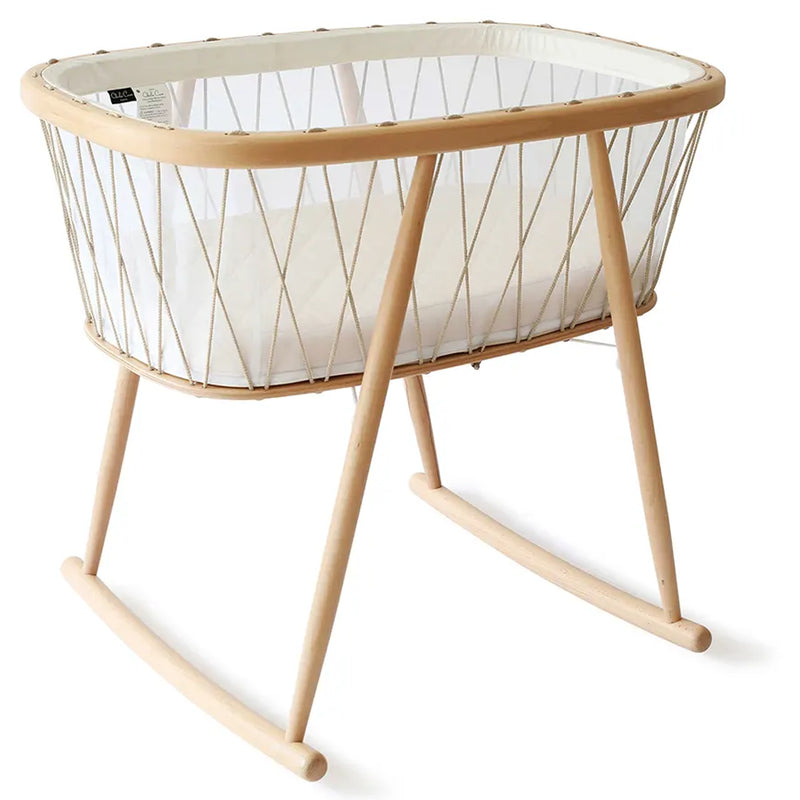 Calm baby space styling highlights the KUMI Charlie Crane Cradle in desert for newborn safe sleep