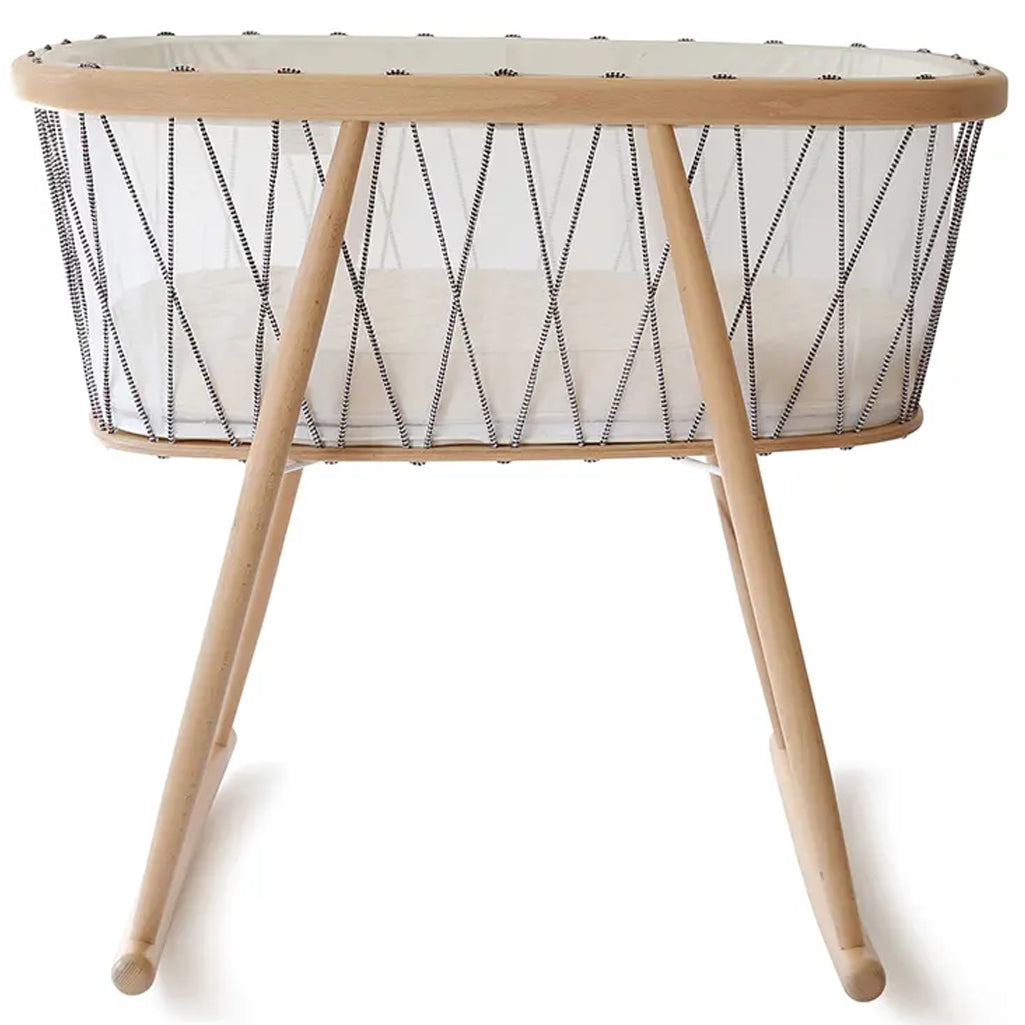 Close up mattress detail features the Charlie Crane Cradle KUMI in bois de rose with coconut mattress