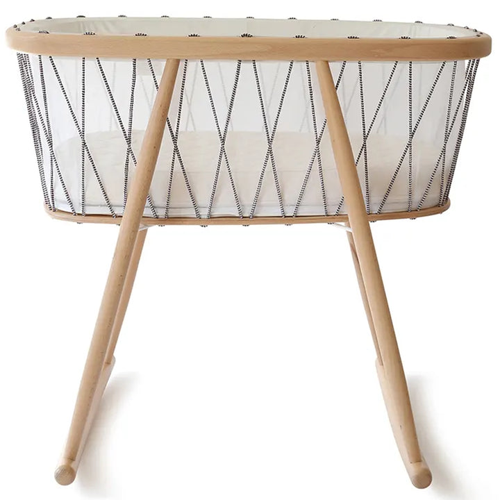 Close up mattress detail features the Charlie Crane Cradle KUMI in bois de rose with coconut mattress