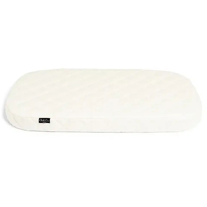 Warm interior styling showcases the Charlie Crane Cradle KUMI in hazelnut with midcentury modern lines