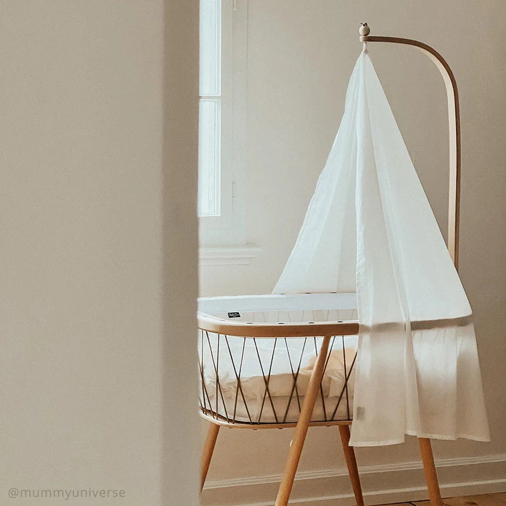 Front profile displays the KUMI Cradle Charlie Crane in desert designed as a baby safe bassinet