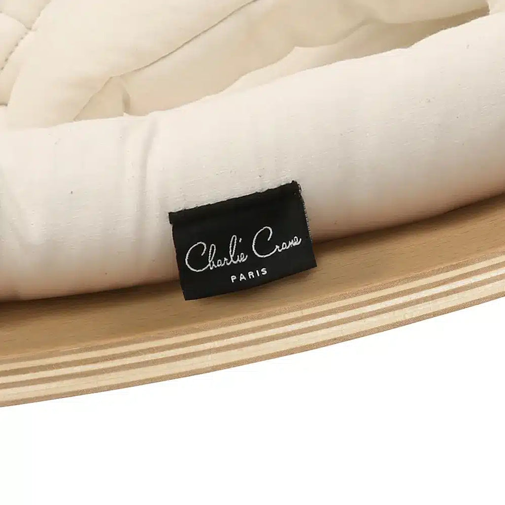 A cozy setup with the Levo Rocker by Charlie Crane in mimosa, designed as an infant safe baby bouncer