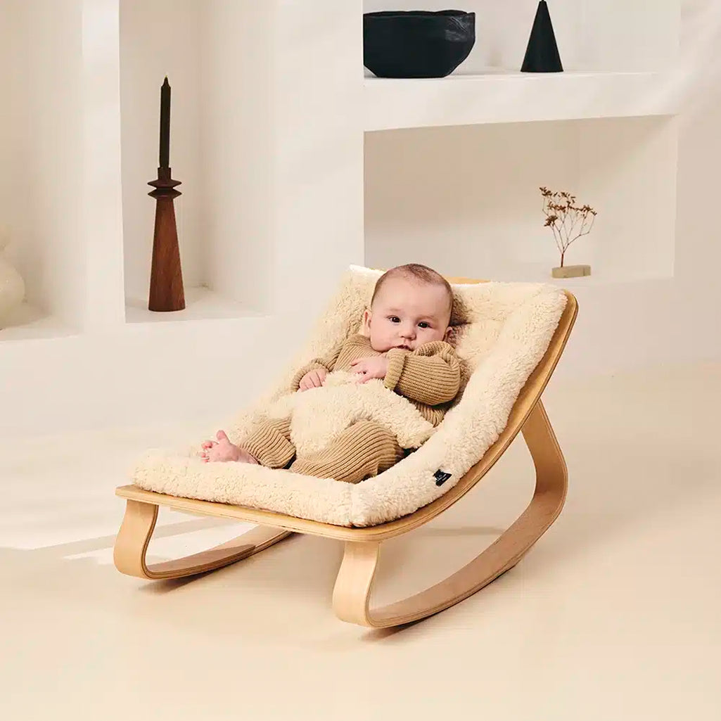 Modern interior scene with the Levo Rocker Beech Wood from Charlie Crane in camel, a newborn safe seating choice