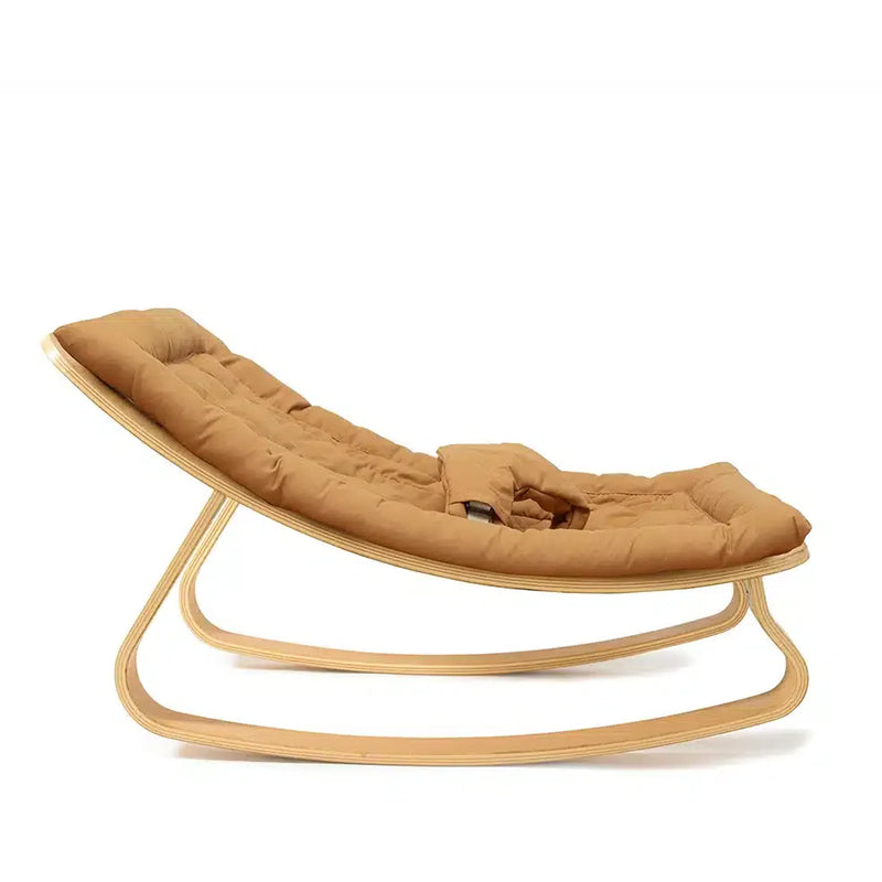 Beech frame elegance with Charlie Crane Levo Rocker in milk fur, a baby rocker with natural rocking motion and sculptural nursery decor appeal