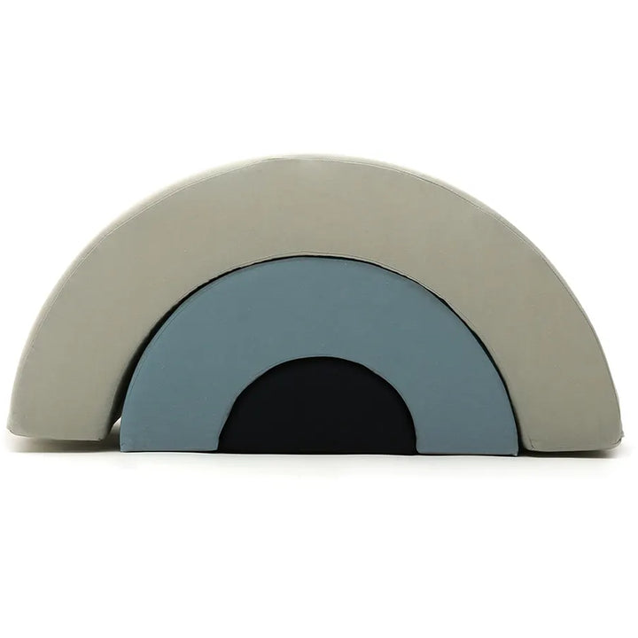 Artful nursery vignette displays the Charlie Crane MILO Wooden Rainbow in farrow with refined style