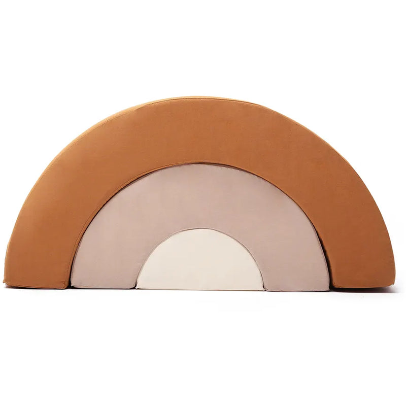 Softly styled room scene shows the Charlie Crane MILO Rainbow in rosewood as a baby safe toy