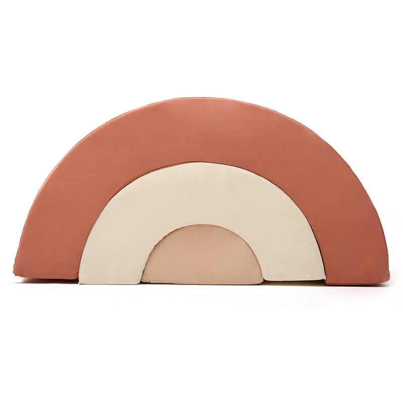 Balanced curved shapes present the MILO Rainbow Infant Toy by Charlie Crane in camel made infant safe