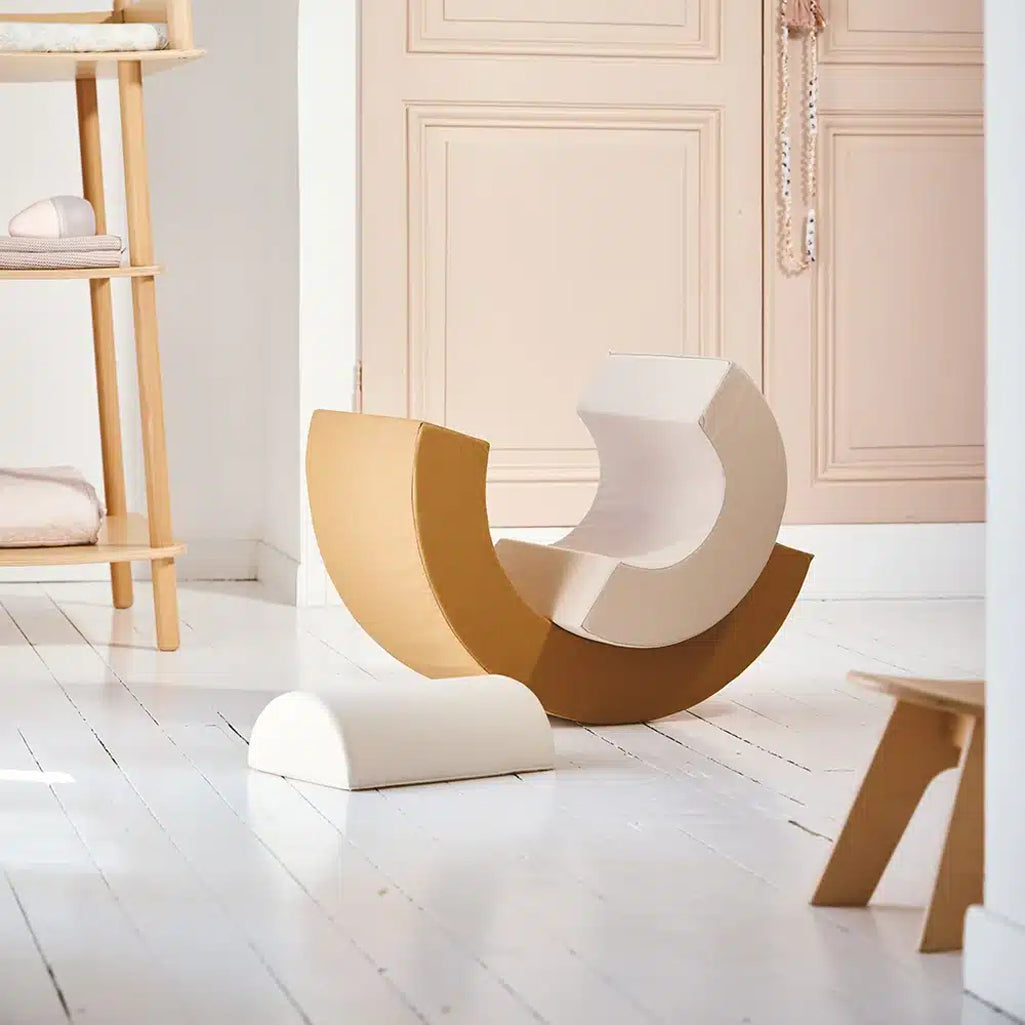 Stacked arc detail features the Charlie Crane MILO Active Toy in farrow for engaging movement