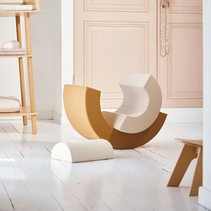 Stacked arc detail features the Charlie Crane MILO Active Toy in farrow for engaging movement