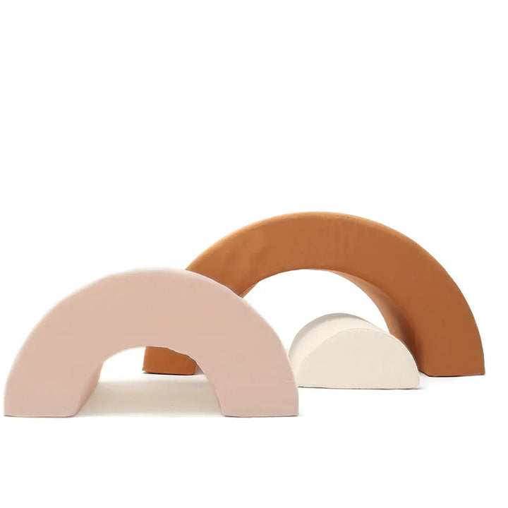 Curved rainbow form displays the Charlie Crane MILO Rainbow in farrow with an organic aesthetic