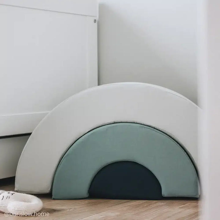 Clean interior scene presents the Charlie Crane MILO Wooden Rainbow in farrow inspired by French design