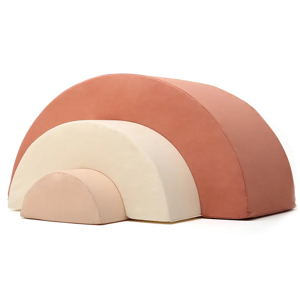 Angled playroom styling shows the Charlie Crane MILO Rainbow in farrow with a midcentury modern design