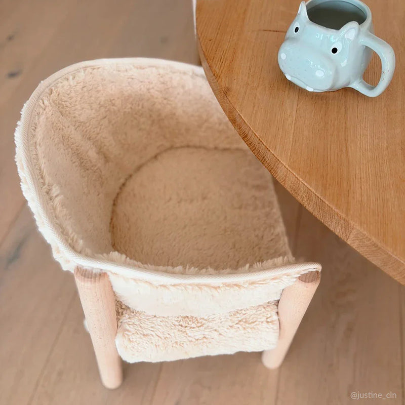 Warm lifestyle scene displays the Charlie Crane SABO Fur Chair in milk created for infant spaces