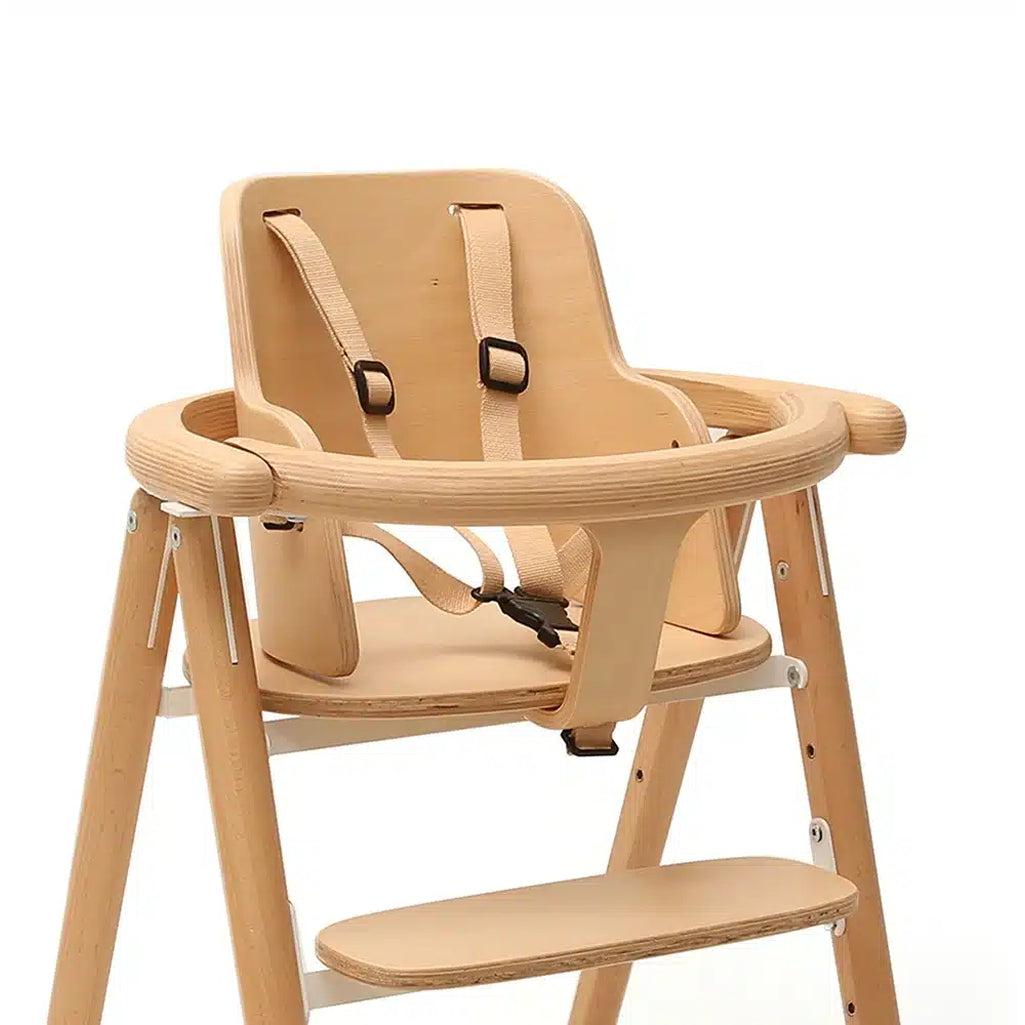 close up of natural ooden tobo charlie krane highchair and babyseat with adjustable straps perfect for toddler