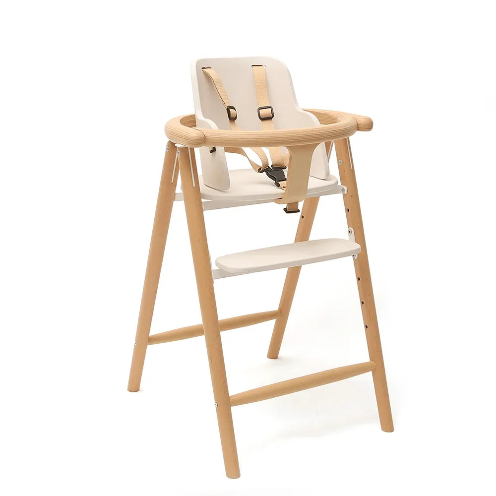 Charlie Crane TOBO High Chair and Baby Set Kit in White, three-quarter view with 5-point safety harness