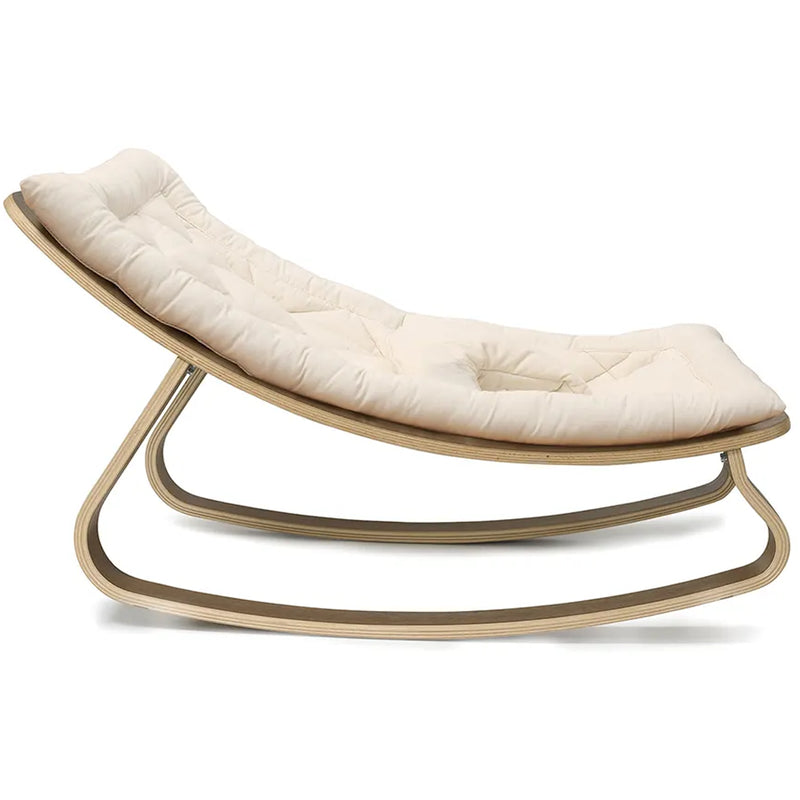 A warm lifestyle view of the Levo Rocker Walnut Wood from Charlie Crane in mimosa designed for baby comfort