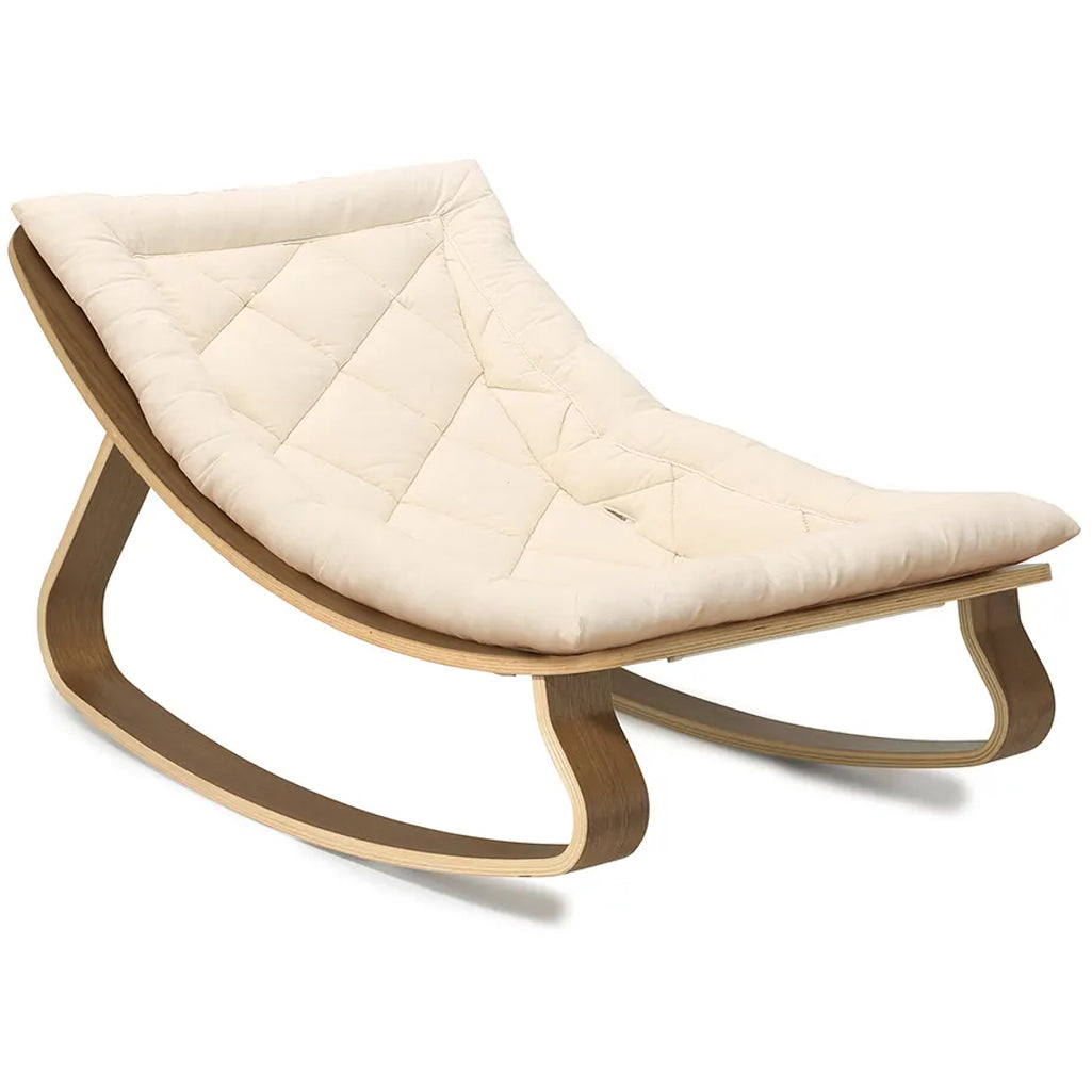 Studio detail highlights the Charlie Crane Walnut Wood Levo Rocker in milk fur with French design influence