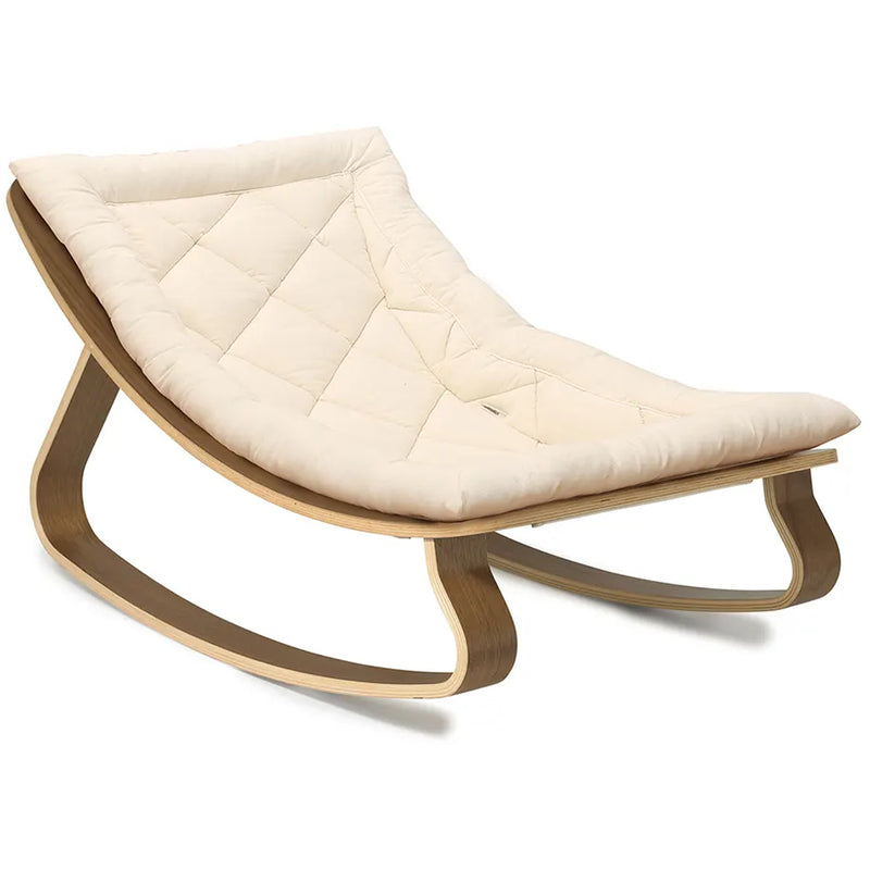Studio detail highlights the Charlie Crane Walnut Wood Levo Rocker in milk fur with French design influence