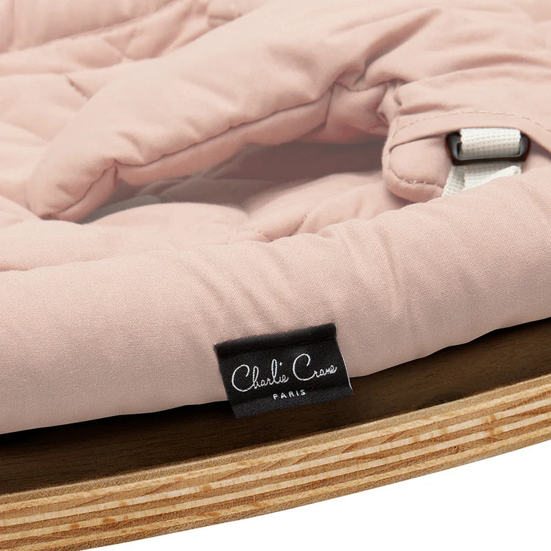 Natural light reveals the Charlie Crane Levo Rocker in walnut wood and milk fur with a wooden finish