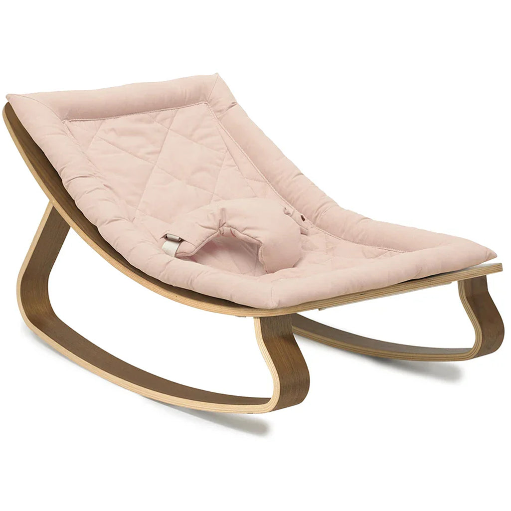 Close detail of walnut frame on the Levo Rocker by Charlie Crane in mimosa, crafted from sustainable materials