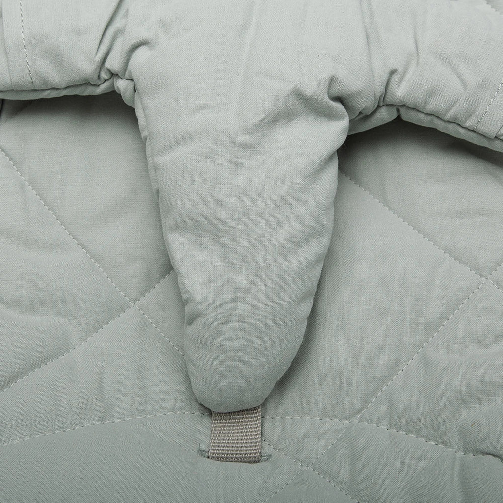 Soft texture close up shows the Walnut Wood Levo Rocker by Charlie Crane in mimosa as a baby bouncer