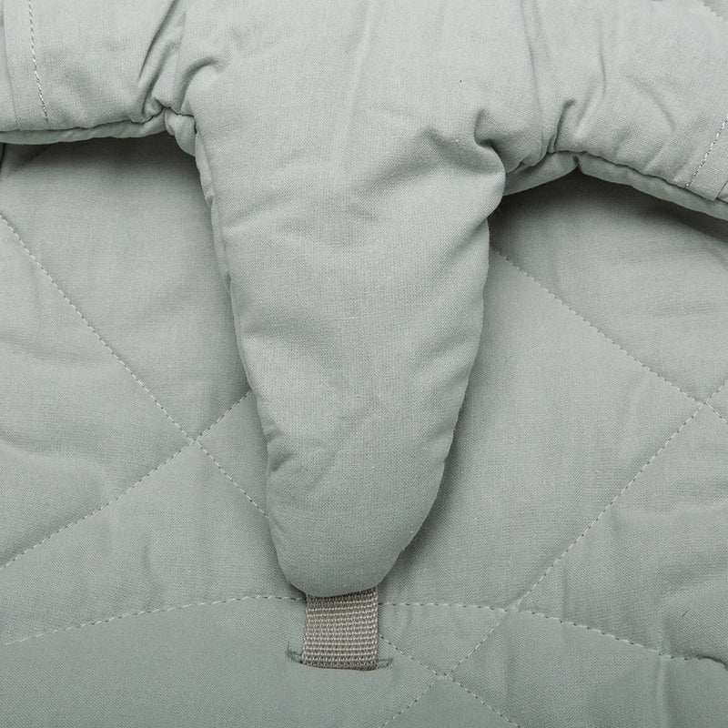 Soft texture close up shows the Walnut Wood Levo Rocker by Charlie Crane in mimosa as a baby bouncer