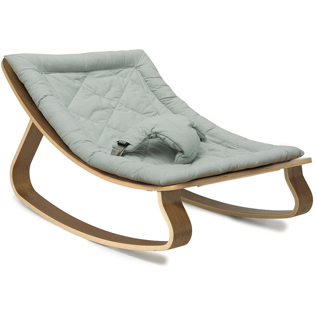 A warm interior view of the Levo Rocker Walnut Wood from Charlie Crane in mimosa designed for baby comfort