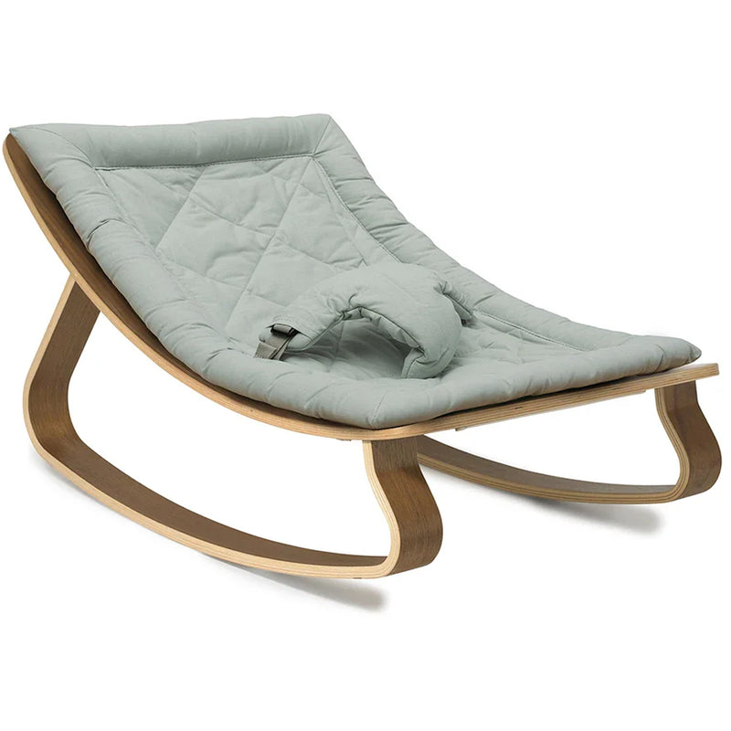A warm interior view of the Levo Rocker Walnut Wood from Charlie Crane in mimosa designed for baby comfort