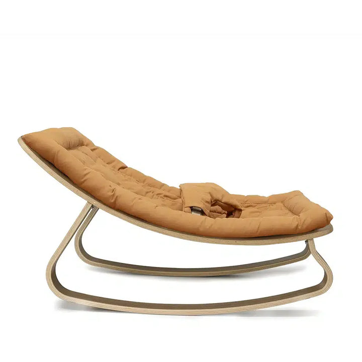 Refined styling shows the Charlie Crane Walnut Wood Levo Rocker in milk fur with a sophisticated look