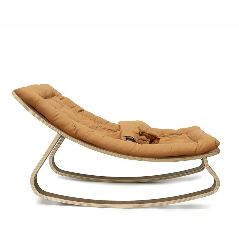 Refined styling shows the Charlie Crane Walnut Wood Levo Rocker in milk fur with a sophisticated look