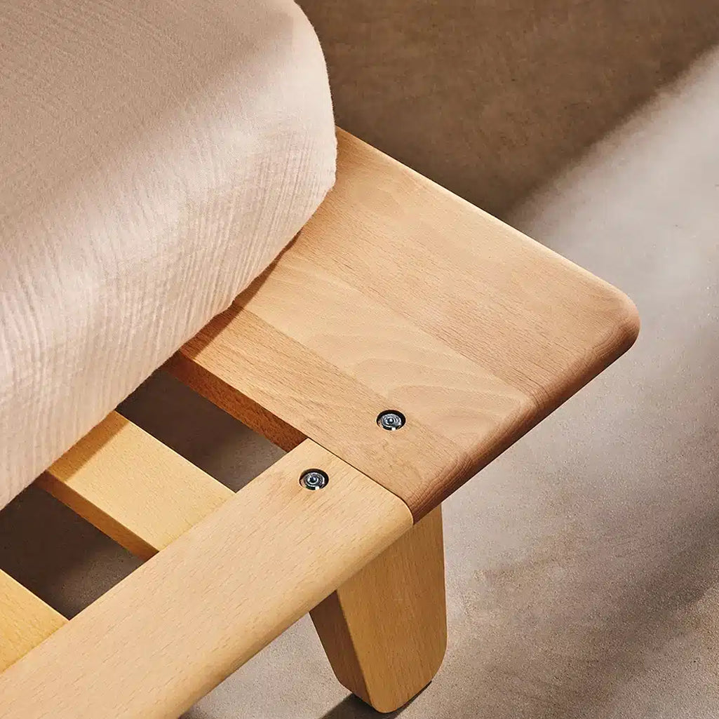 close up of charlie crane yomi junior bed frame showcasing its raw wood finish and sophisticated design