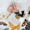 baby with clementine kids blanket swaddle