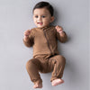 Happy baby wearing the Zipper romper in the shade coffee.